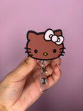 brown kitty badge reel