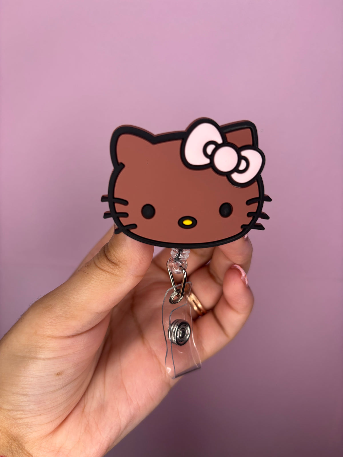 brown kitty badge reel